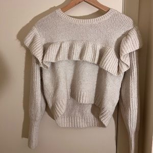 White sweater with ruffle detail